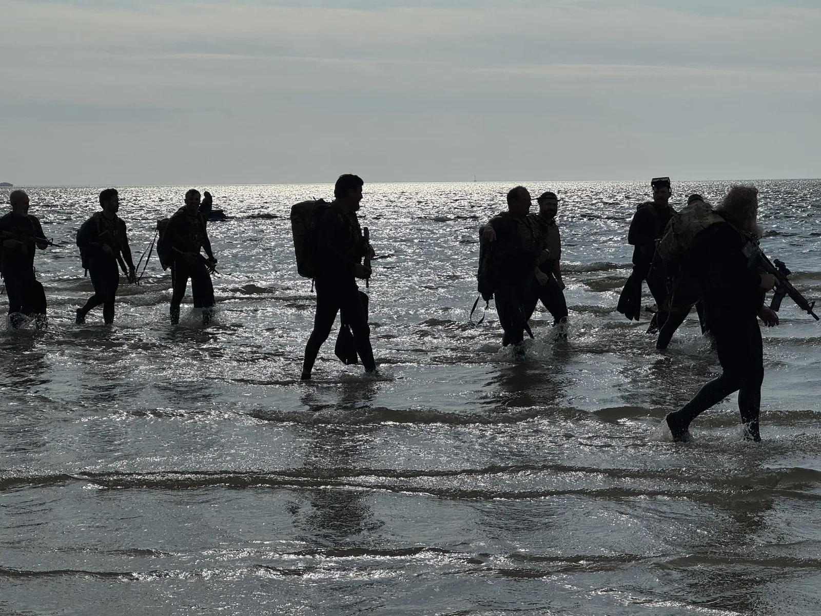Platoon Wave operators completing an over-the-beach landing at dawn